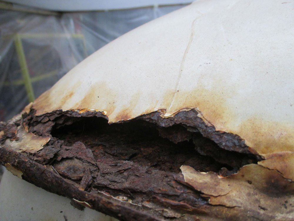 Rusted bodywork on a VW Camper Bay Window