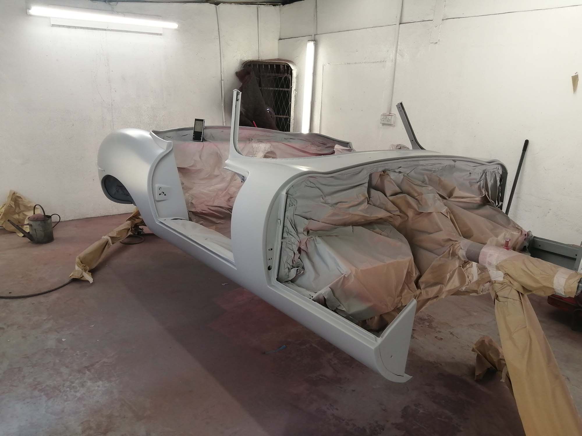 E-type Jaguar being sprayed